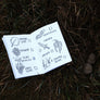 Closeup of the illustrated Nature Quest Scavenger Hunt Book by Keep Tassie Wild