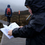 Kid holding the Nature Quest Scavenger Hunt Book while on a bushwalk