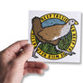 Hand holding Tasmanian turbo chook bumper sticker