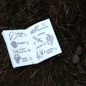 Closeup of the illustrated Nature Quest Scavenger Hunt Book by Keep Tassie Wild