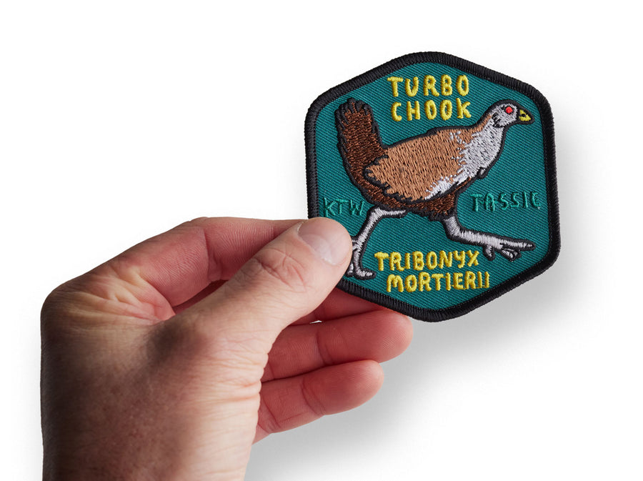 Hand holding the turbo chook patch by Keep Tassie Wild 